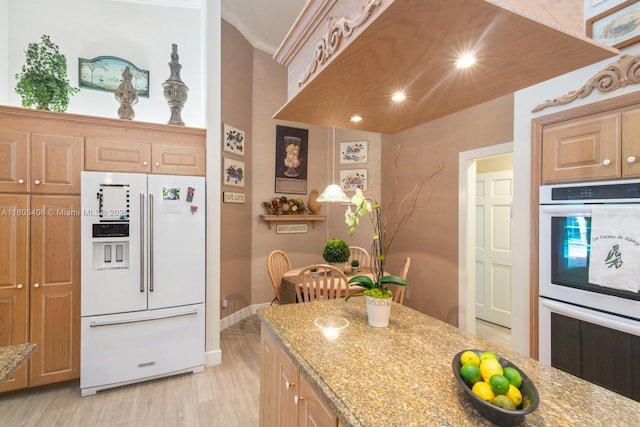 7395 SW 166th St, Palmetto Bay, FL 33157 - kitchen with white appliances, light wood-type flooring, light stone countertops, ornamental molding, and baseboards