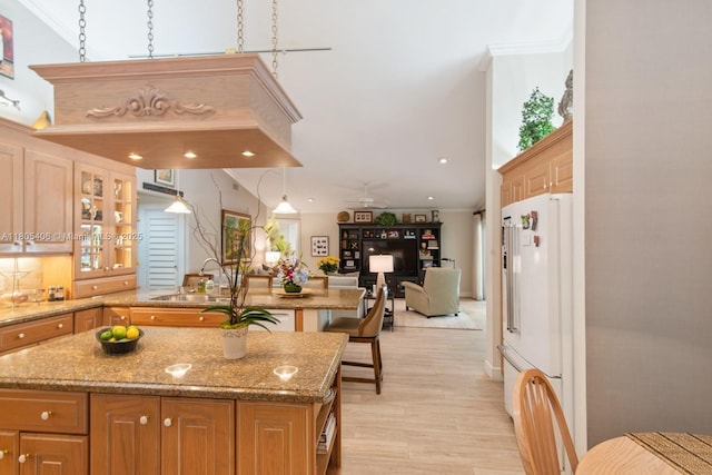 7395 SW 166th St, Palmetto Bay, FL 33157 - kitchen with freestanding refrigerator, a sink, light wood-style floors, a kitchen island, and glass insert cabinets