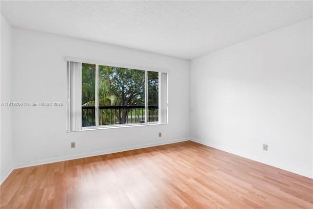 9906 Twin Lakes Dr Unit 7-I, Coral Springs, FL 33071 - unfurnished room featuring light wood finished floors and baseboards