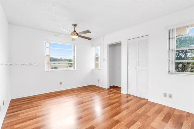 9906 Twin Lakes Dr Unit 7-I, Coral Springs, FL 33071 - unfurnished bedroom with light wood finished floors, multiple closets, baseboards, and a ceiling fan