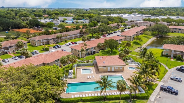 9906 Twin Lakes Dr Unit 7-I, Coral Springs, FL 33071 - drone / aerial view of a pool area and a large body of water