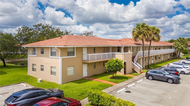 9906 Twin Lakes Dr Unit 7-I, Coral Springs, FL 33071 - view of property featuring uncovered parking and stairs