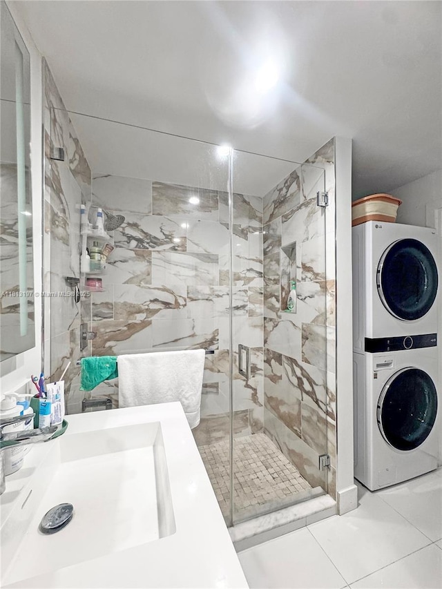 350 W 16th St, Hialeah, FL 33010 - full bathroom featuring stacked washing machine and dryer, a stall shower, and vanity