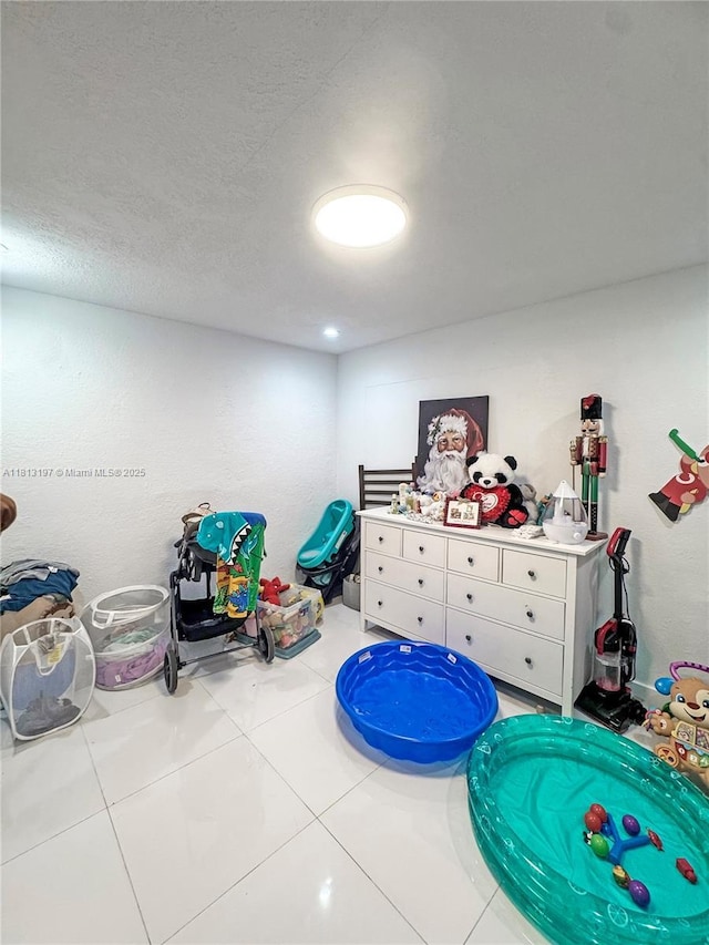 350 W 16th St, Hialeah, FL 33010 - game room featuring tile patterned floors and a textured ceiling
