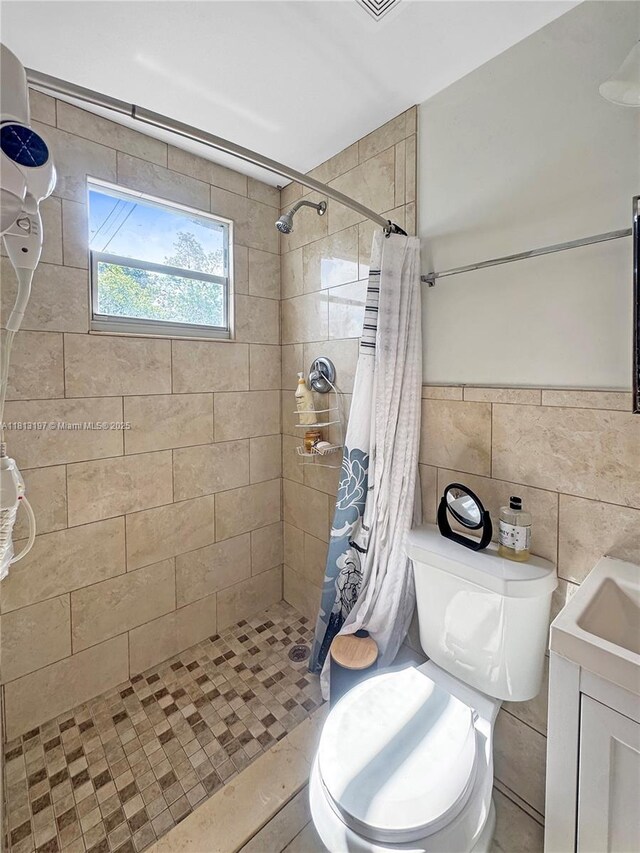 350 W 16th St, Hialeah, FL 33010 - full bath featuring a tile shower, tile walls, and vanity