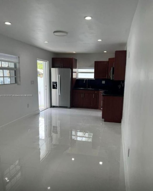 350 W 16th St, Hialeah, FL 33010 - kitchen featuring stainless steel appliances, healthy amount of natural light, dark countertops, and recessed lighting