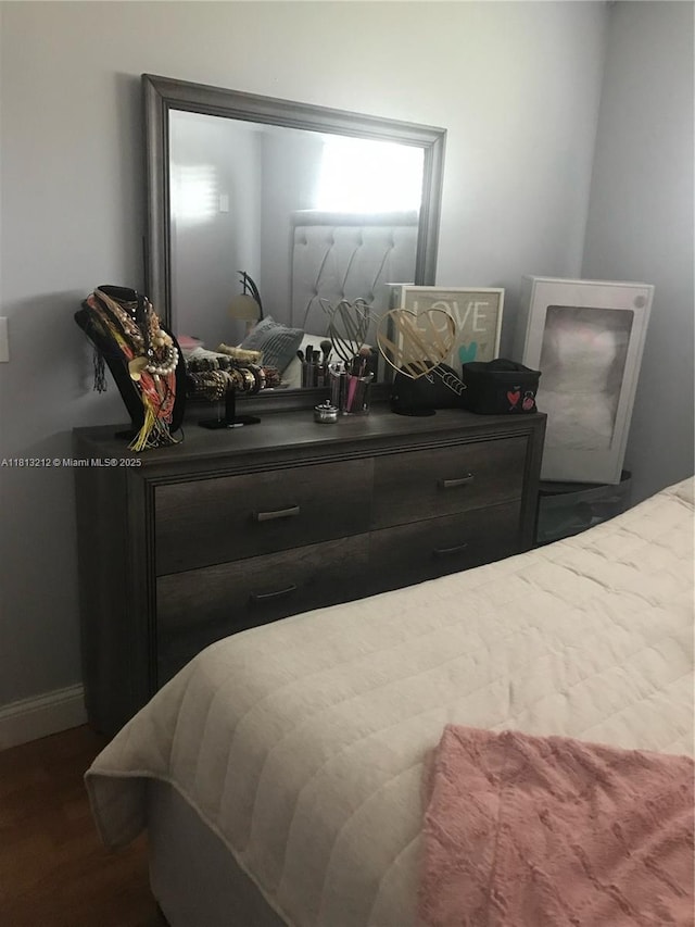 20810 NE 8th Ct Unit 201-18, Miami, FL 33179 - bedroom featuring baseboards and dark wood-type flooring