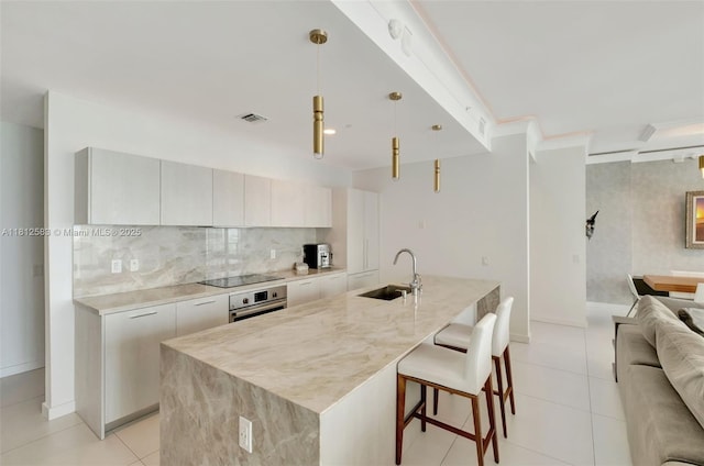 501 NE 31st St Unit Ph4302, Miami, FL 33137 - kitchen with a sink, modern cabinets, open floor plan, and oven