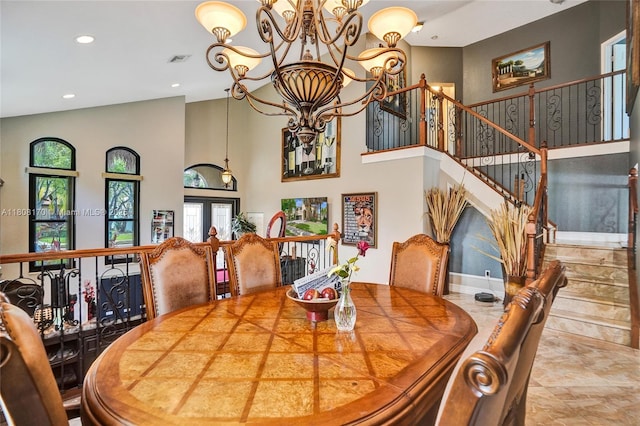 4946 SW 166th Ave, Miramar, FL 33027 - dining room featuring a chandelier, plenty of natural light, recessed lighting, a high ceiling, and stairway