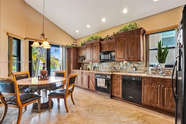4946 SW 166th Ave, Miramar, FL 33027 - kitchen featuring black appliances, a sink, healthy amount of natural light, decorative backsplash, and recessed lighting