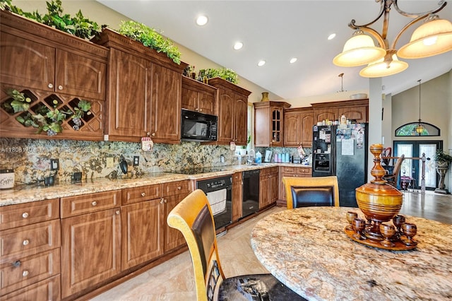 4946 SW 166th Ave, Miramar, FL 33027 - kitchen with black appliances, lofted ceiling, tasteful backsplash, recessed lighting, and pendant lighting