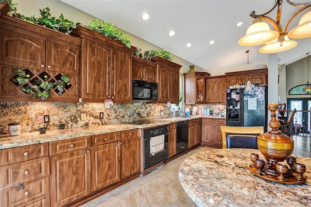 4946 SW 166th Ave, Miramar, FL 33027 - kitchen with black appliances, a sink, tasteful backsplash, light stone counters, and recessed lighting