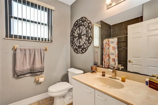 4946 SW 166th Ave, Miramar, FL 33027 - bathroom with vanity, toilet, tiled shower, and baseboards