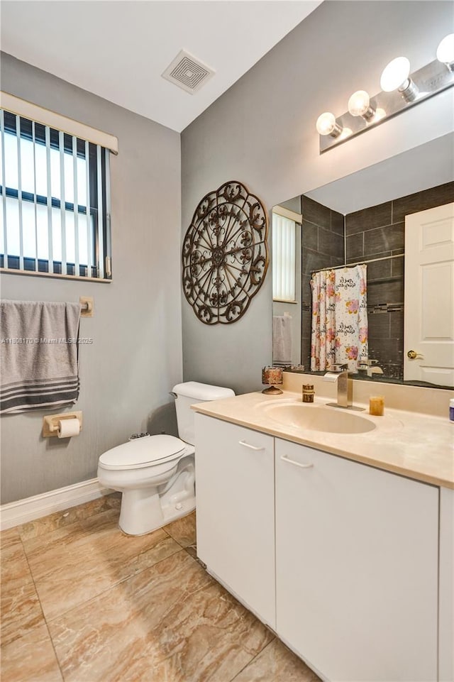 4946 SW 166th Ave, Miramar, FL 33027 - bathroom with vanity, toilet, curtained shower, and baseboards