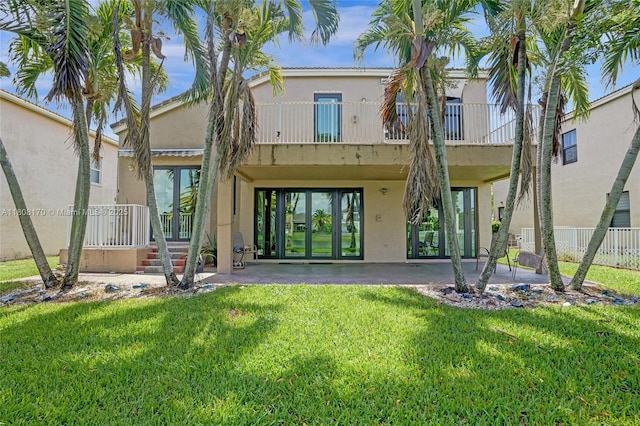 4946 SW 166th Ave, Miramar, FL 33027 - rear view of property featuring stucco siding, a patio, french doors, and a carport