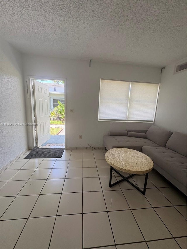1239 Marseille Dr Unit 7, Miami Beach, FL 33141 - living area featuring a textured ceiling