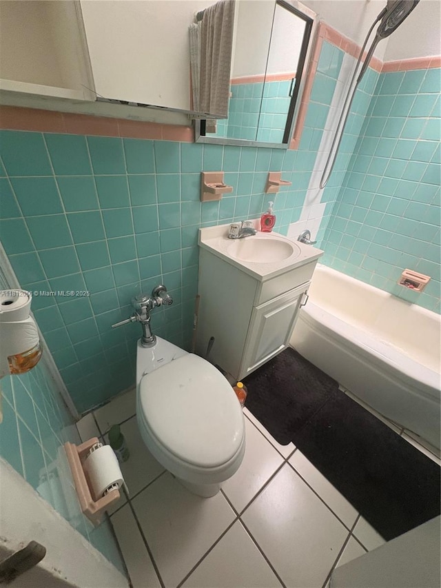 1239 Marseille Dr Unit 7, Miami Beach, FL 33141 - full bath with tile walls, vanity, tub / shower combination, tile patterned floors, and toilet