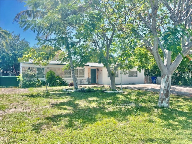 2465 NE 15th Ave, Pompano Beach, FL 33064 - obstructed view of property with stucco siding