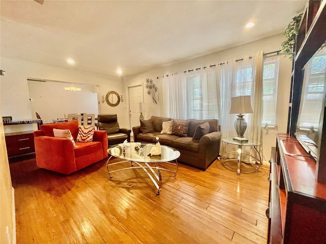 2465 NE 15th Ave, Pompano Beach, FL 33064 - living room featuring light wood-style flooring, a chandelier, and recessed lighting