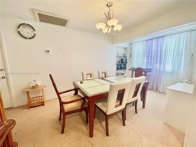 2465 NE 15th Ave, Pompano Beach, FL 33064 - dining room featuring a chandelier and light colored carpet