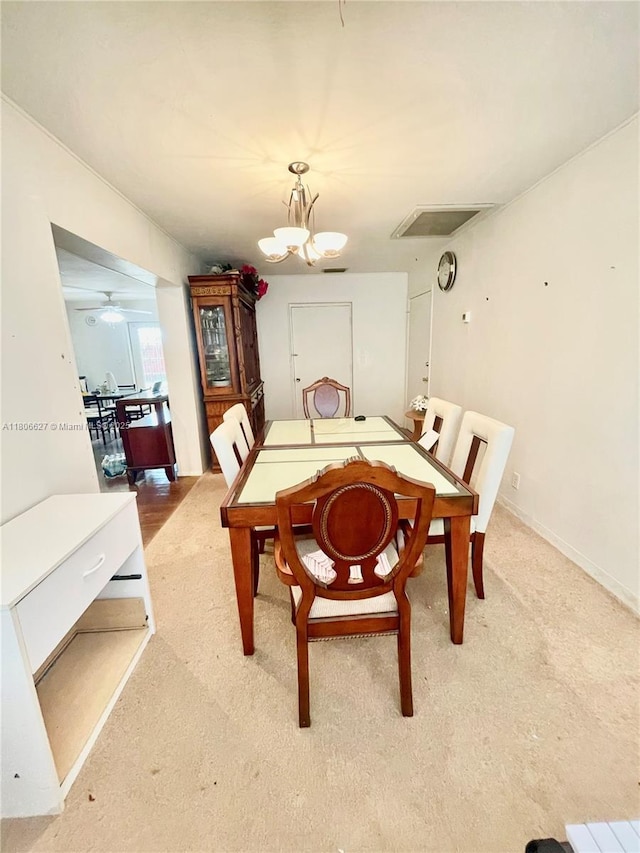 2465 NE 15th Ave, Pompano Beach, FL 33064 - dining room with carpet and a chandelier