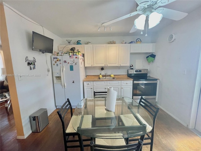 2465 NE 15th Ave, Pompano Beach, FL 33064 - dining room featuring light wood-style floors, ceiling fan, and baseboards