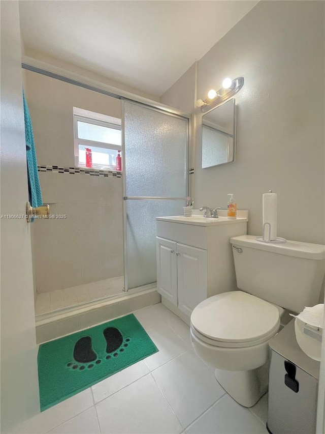 2465 NE 15th Ave, Pompano Beach, FL 33064 - full bath with vanity, a shower stall, tile patterned flooring, and toilet