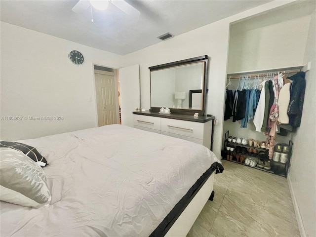 2465 NE 15th Ave, Pompano Beach, FL 33064 - bedroom with baseboards, a closet, and ceiling fan