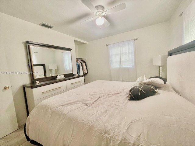 2465 NE 15th Ave, Pompano Beach, FL 33064 - bedroom with a ceiling fan and light wood finished floors