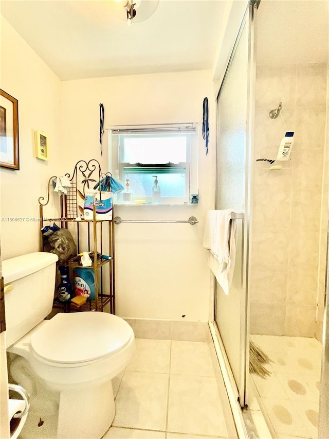 2465 NE 15th Ave, Pompano Beach, FL 33064 - full bathroom featuring a shower stall, toilet, and tile patterned floors
