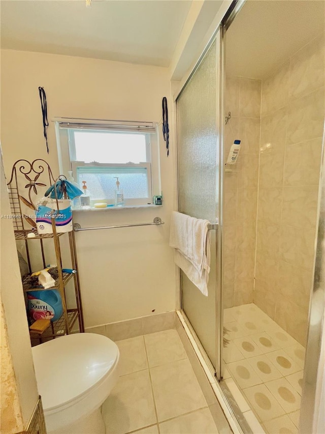 2465 NE 15th Ave, Pompano Beach, FL 33064 - bathroom featuring a shower stall, tile patterned floors, and toilet