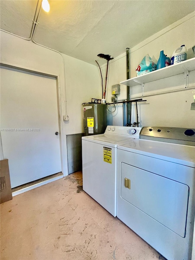 2465 NE 15th Ave, Pompano Beach, FL 33064 - washroom featuring water heater and washing machine and dryer