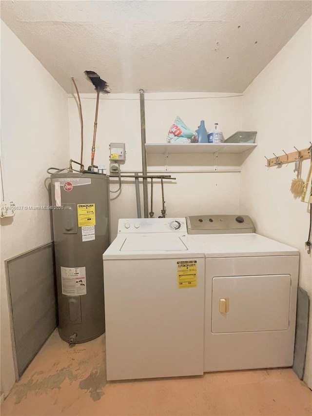 2465 NE 15th Ave, Pompano Beach, FL 33064 - laundry room with electric water heater and washer and clothes dryer