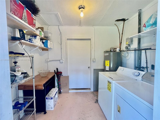 2465 NE 15th Ave, Pompano Beach, FL 33064 - washroom featuring water heater and separate washer and dryer