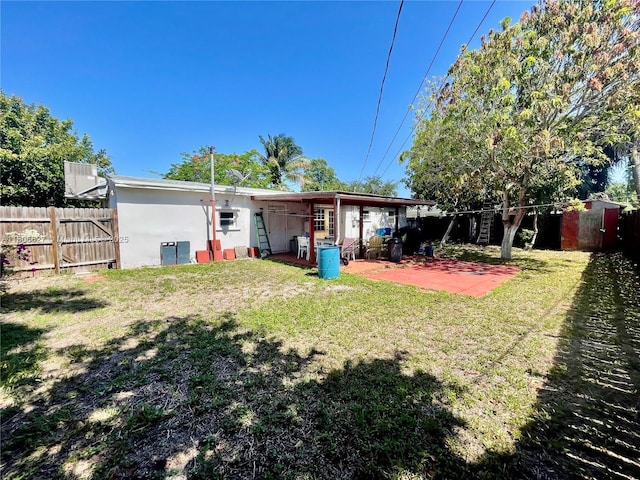 2465 NE 15th Ave, Pompano Beach, FL 33064 - back of house with a patio and stucco siding
