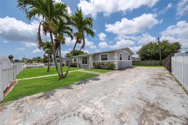 610 Snowden Dr, Lake Worth, FL 33461 - ranch-style home featuring driveway and stucco siding
