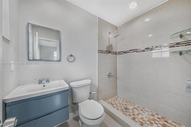 610 Snowden Dr, Lake Worth, FL 33461 - full bathroom with toilet, tiled shower, and vanity