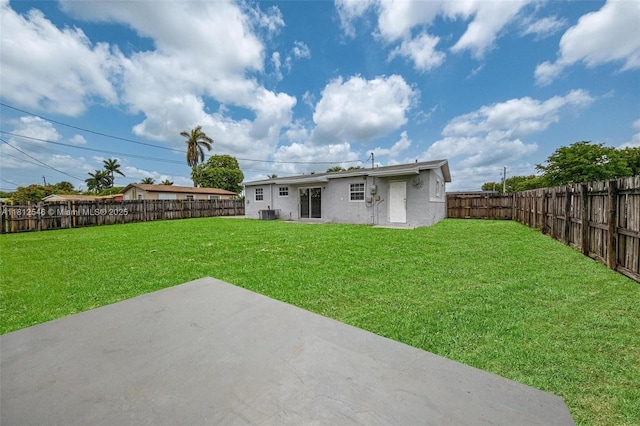 610 Snowden Dr, Lake Worth, FL 33461 - rear view of property featuring a patio area and stucco siding