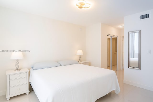9201 Collins Ave Unit 624, Surfside, FL 33154 - bedroom with a closet and light tile patterned floors