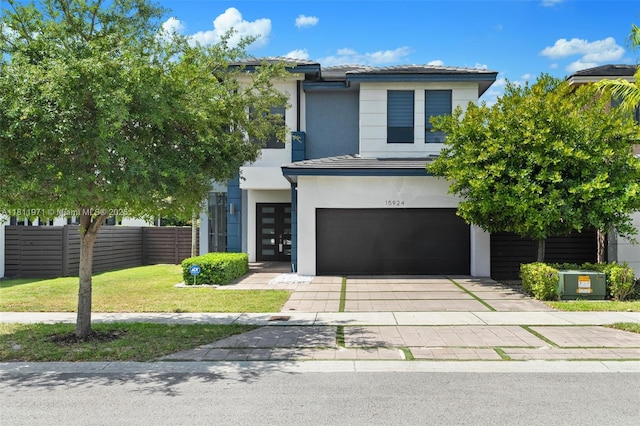 15924 SW 136th Way, Miami, FL 33196 - view of front of house with an attached garage, driveway, and stucco siding