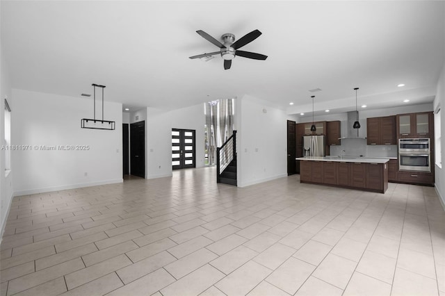 15924 SW 136th Way, Miami, FL 33196 - unfurnished living room with recessed lighting, a ceiling fan, and stairs