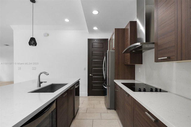 15924 SW 136th Way, Miami, FL 33196 - kitchen with wall chimney range hood, stainless steel appliances, light countertops, dark brown cabinets, and pendant lighting