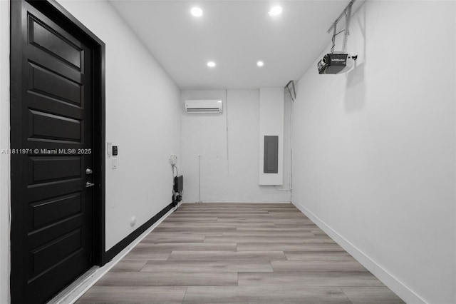 15924 SW 136th Way, Miami, FL 33196 - hallway with electric panel, recessed lighting, a wall mounted air conditioner, and light wood-style flooring