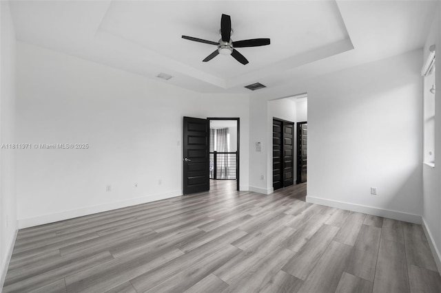 15924 SW 136th Way, Miami, FL 33196 - unfurnished room with a raised ceiling, ceiling fan, and light wood-style flooring
