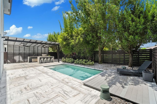 15924 SW 136th Way, Miami, FL 33196 - view of pool featuring a wooden deck, a fenced backyard, and a pergola