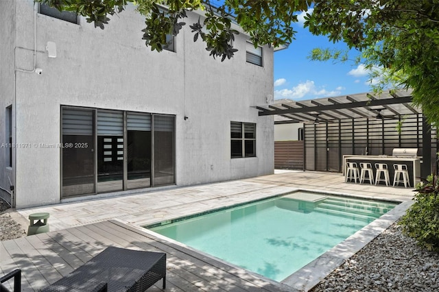 15924 SW 136th Way, Miami, FL 33196 - outdoor pool with a pergola, a patio area, and a wooden deck