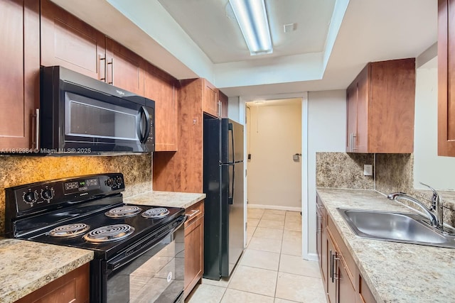 766 NW 35th Ave, Lauderhill, FL 33311 - kitchen with black appliances, a sink, decorative backsplash, and light tile patterned floors