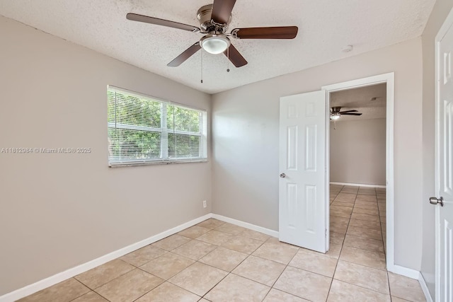 766 NW 35th Ave, Lauderhill, FL 33311 - unfurnished room with light tile patterned flooring, a textured ceiling, a ceiling fan, and baseboards