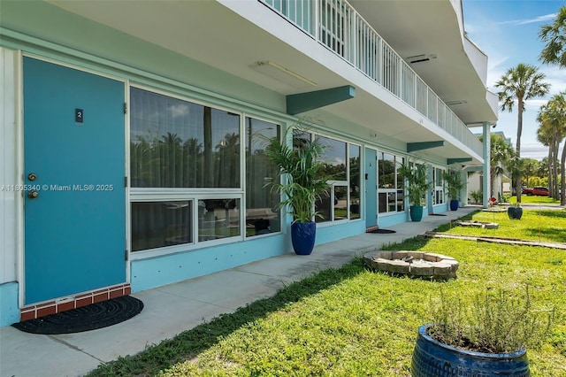 733 NW 30th Ct Unit 2, Wilton Manors, FL 33311 - view of property exterior featuring a lawn