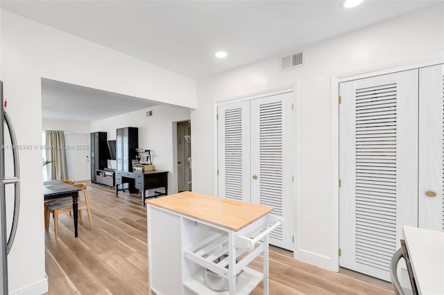 733 NW 30th Ct Unit 2, Wilton Manors, FL 33311 - kitchen with light wood-style flooring and recessed lighting